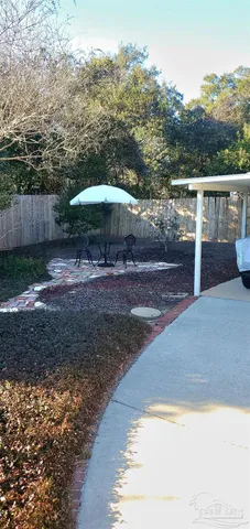 a view of a yard with an outdoor space