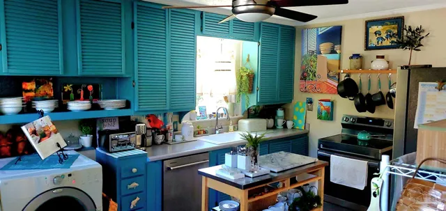 a work place with furniture and a potted plant