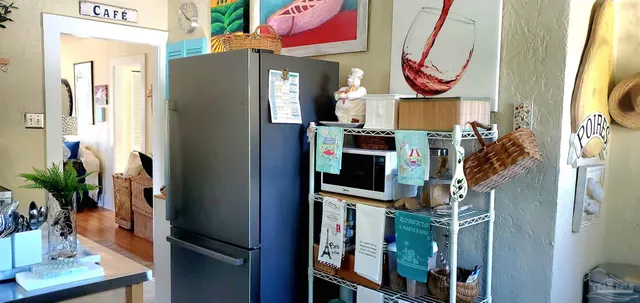 a view of living room with furniture and a fireplace