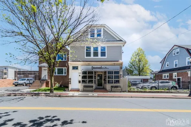 a front view of a building with street view