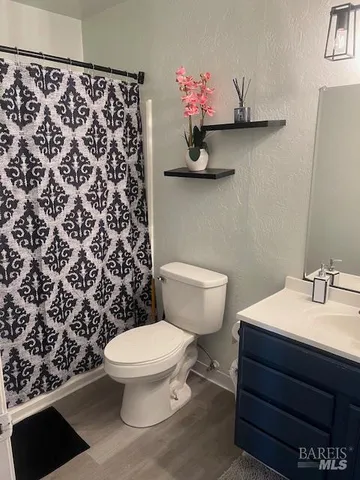 a bathroom with a sink toilet and a shower