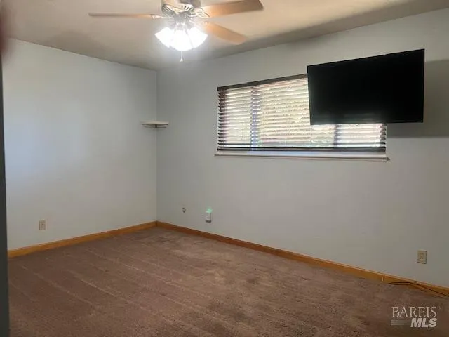 a view of a livingroom with a flat screen tv