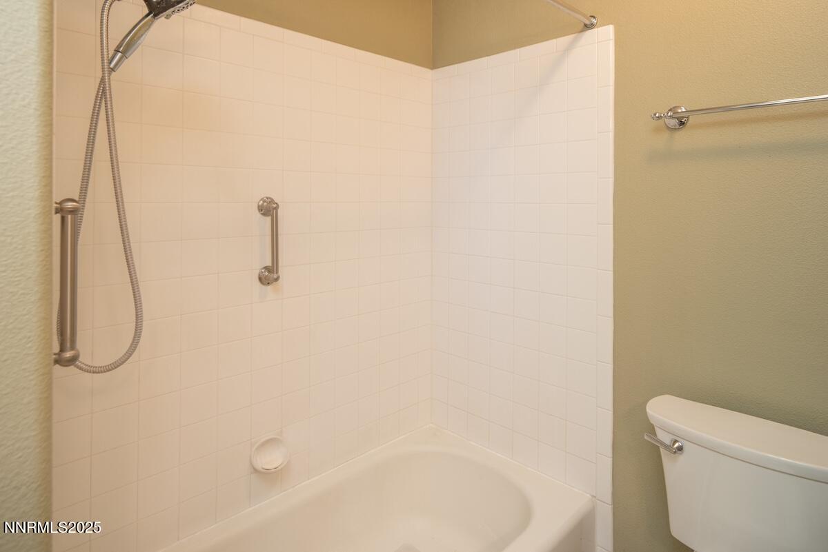609 Nader Way Fernley, NV 89408 - Photo 21 of 38 a bathroom with a shower