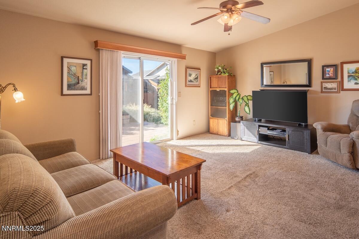 609 Nader Way Fernley, NV 89408 - Photo 9 of 38 a living room with furniture and a flat screen tv