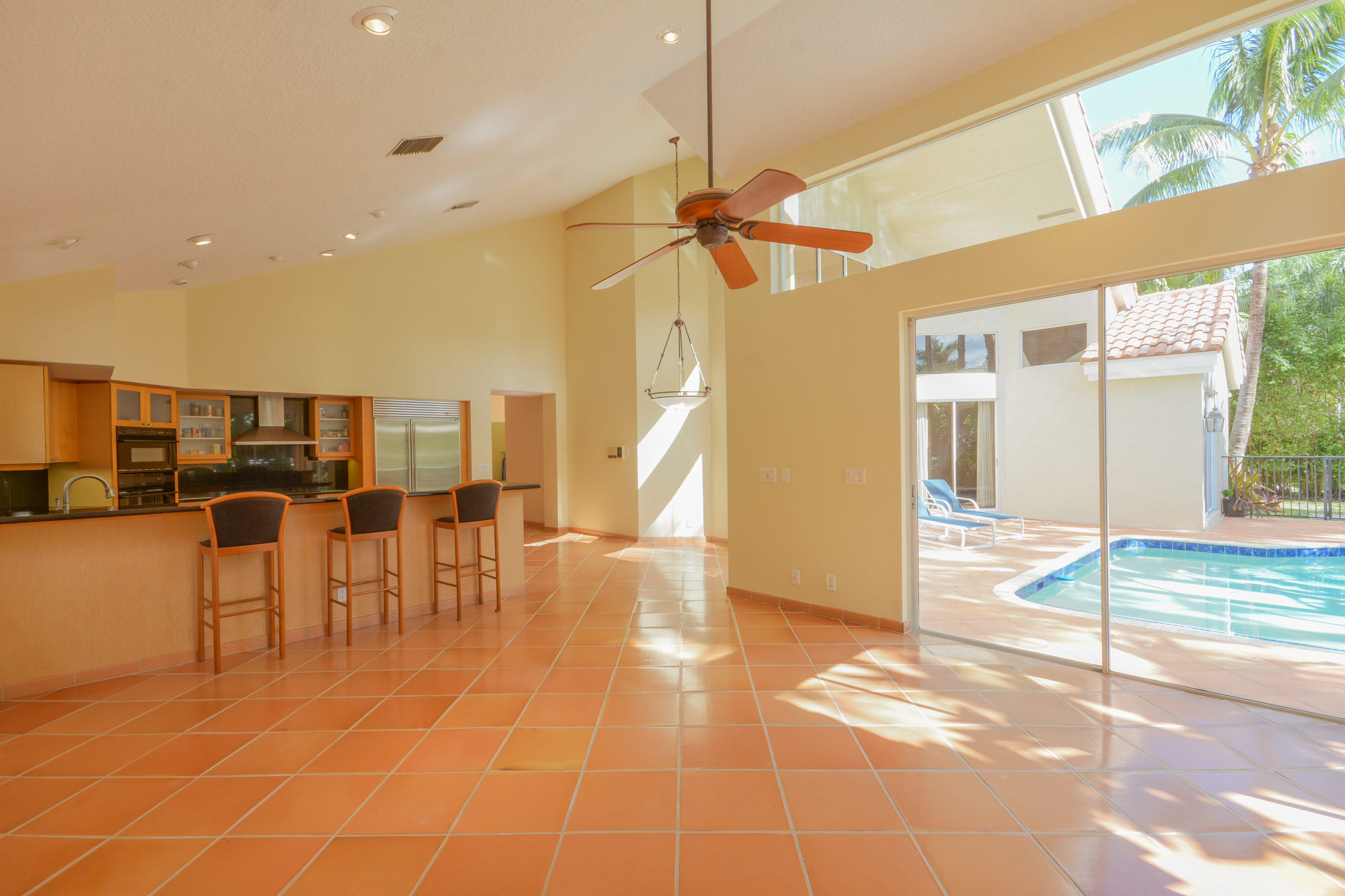 3046 Northwest 61st Street Boca Raton, FL 33496 - Photo 30 of 55 Kitchen and Pool View