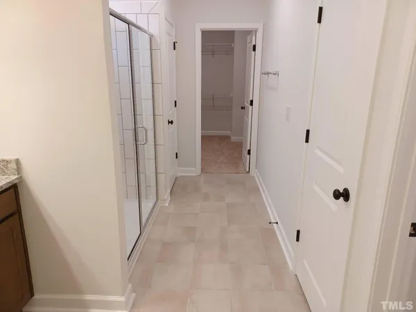 a view of a bathroom from the hallway