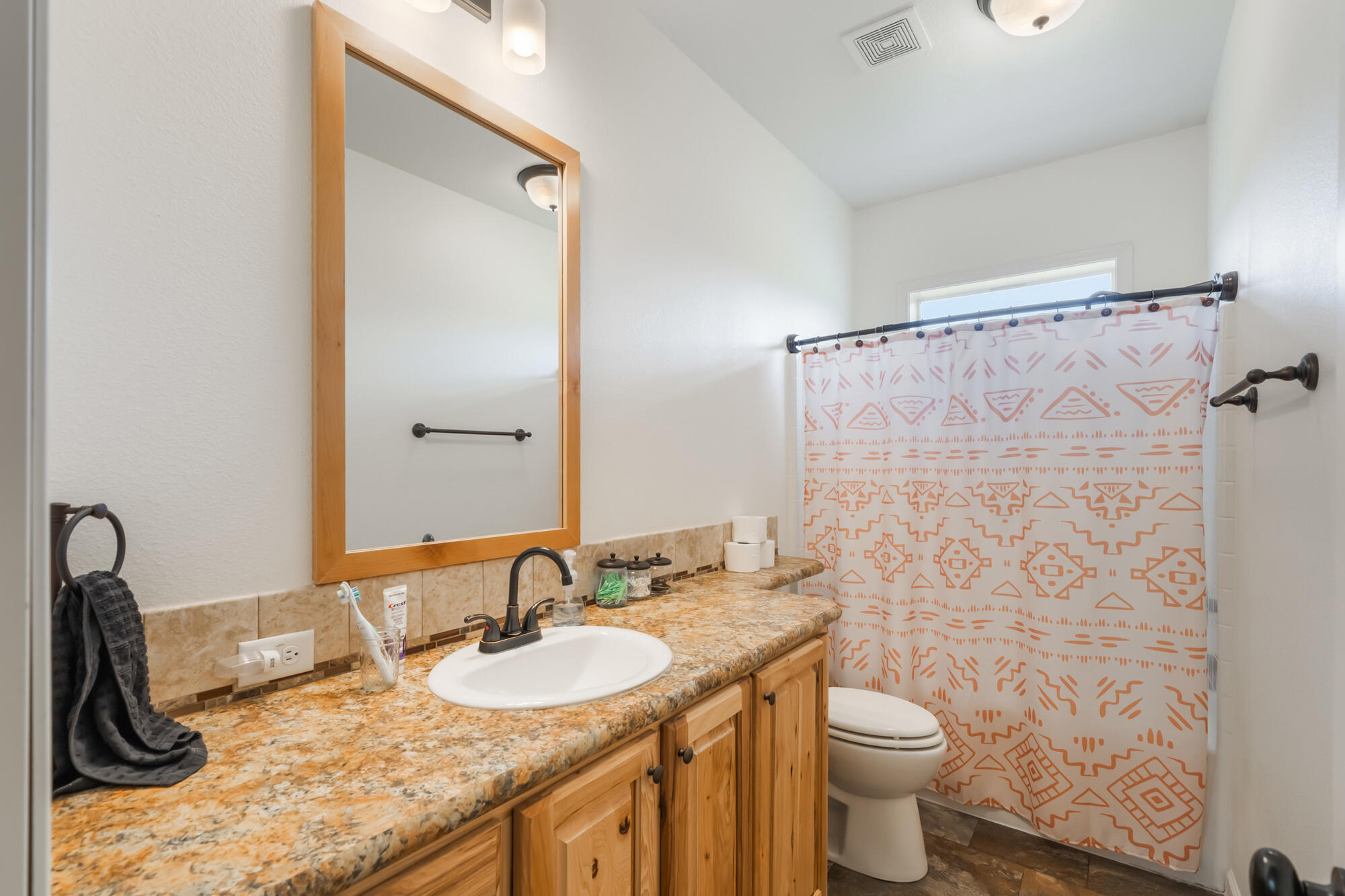 7400 South Prairie Road Tillamook, OR 97141 - Photo 52 of 62 a bathroom with a granite countertop sink toilet and shower