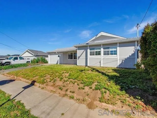 9462 Doheny Road Santee, CA 92071 - Photo 25 of 33 a front view of a house with a garden