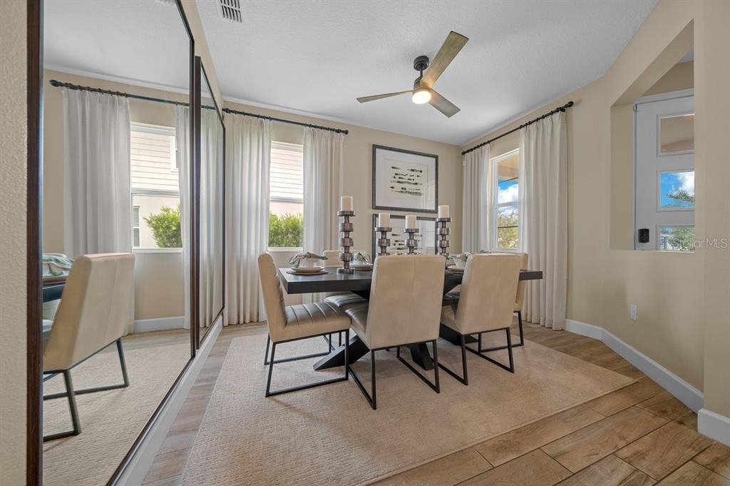 3916 Southern Vista Loop St. Cloud, FL 34772 - Photo 20 of 52 a view of a dining room with furniture and window