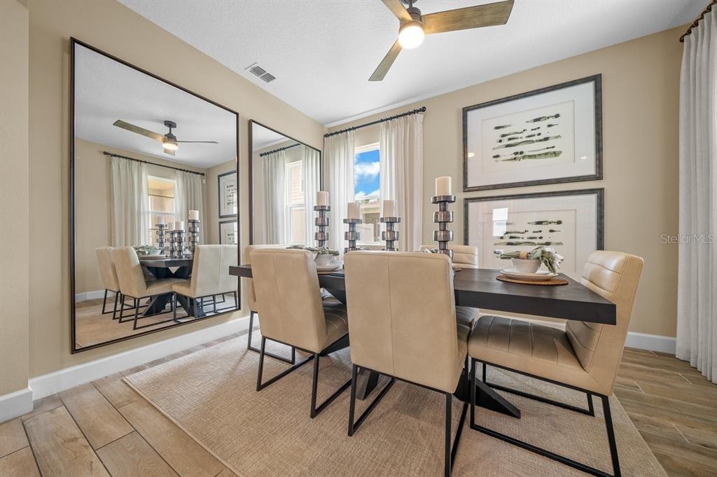 3916 Southern Vista Loop St. Cloud, FL 34772 - Photo 21 of 52 a view of a dining room with furniture
