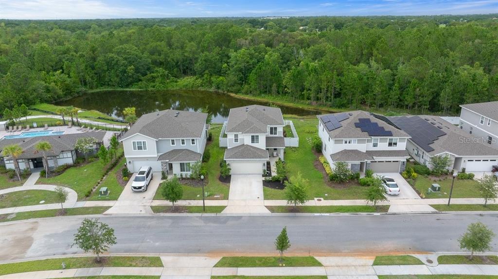 3916 Southern Vista Loop St. Cloud, FL 34772 - Photo 3 of 52 an aerial view of a house