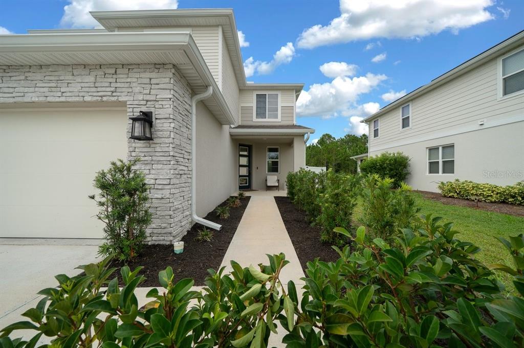 3916 Southern Vista Loop St. Cloud, FL 34772 - Photo 4 of 52 a view of a yard in front of house