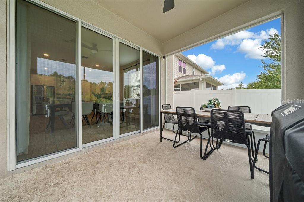 3916 Southern Vista Loop St. Cloud, FL 34772 - Photo 42 of 52 a view of a livingroom with furniture and floor to ceiling window