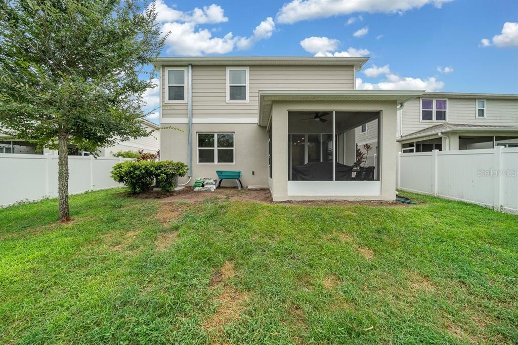 3916 Southern Vista Loop St. Cloud, FL 34772 - Photo 43 of 52 a view of a house with garden