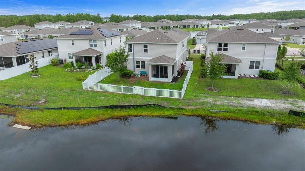 3916 Southern Vista Loop St. Cloud, FL 34772 - Photo 46 of 52 an aerial view of a house with a yard