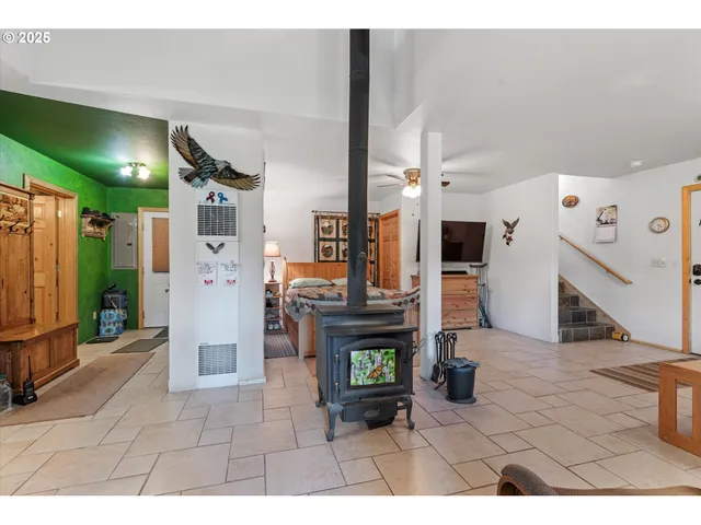a view of living room with furniture and a flat screen tv