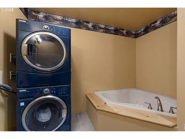 a bathroom with a sink a mirror and bathtub
