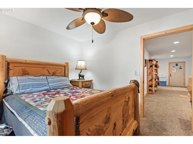 a bedroom with a bed and dresser