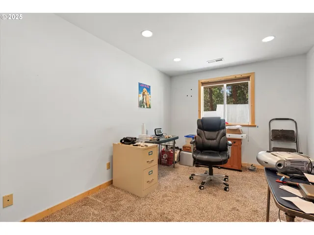 a workspace with furniture and a window