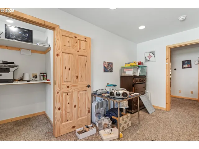 a kitchen with stainless steel appliances kitchen island granite countertop a refrigerator and a stove top oven