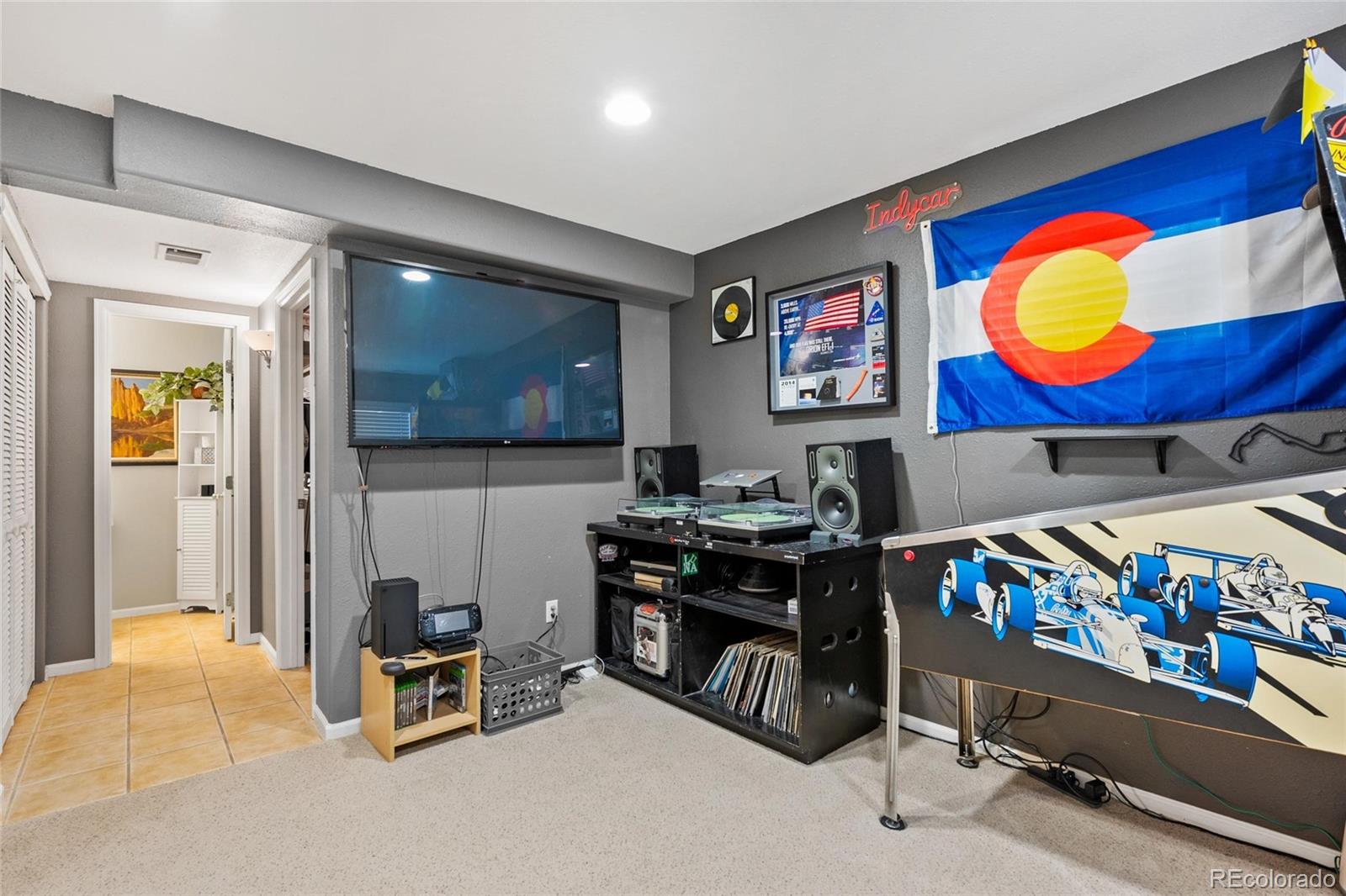 9836 South Castle Ridge Circle Highlands Ranch, CO 80129 - Photo 18 of 28 a living room with furniture and a flat screen tv