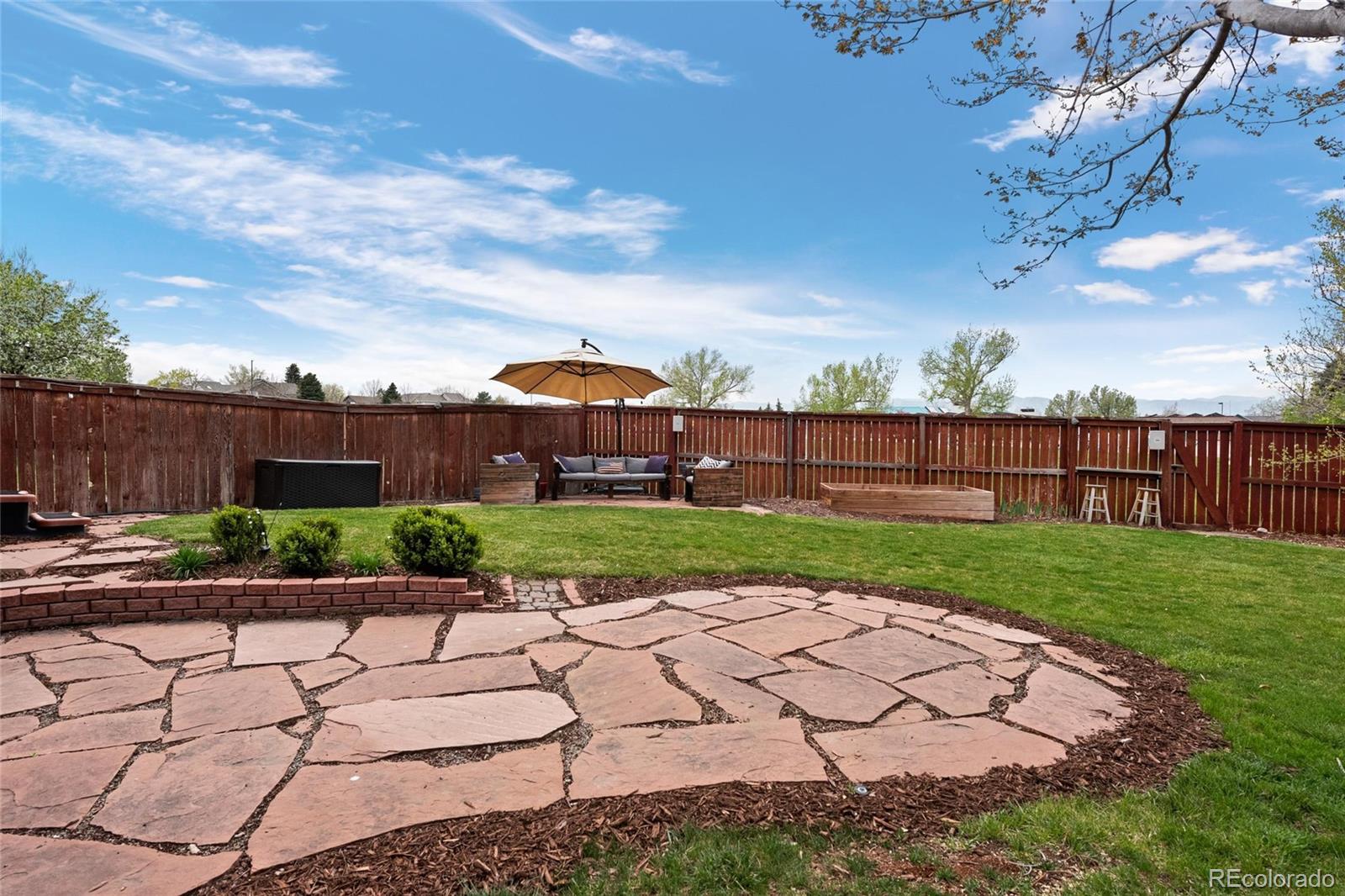 9836 South Castle Ridge Circle Highlands Ranch, CO 80129 - Photo 21 of 28 a view of a backyard