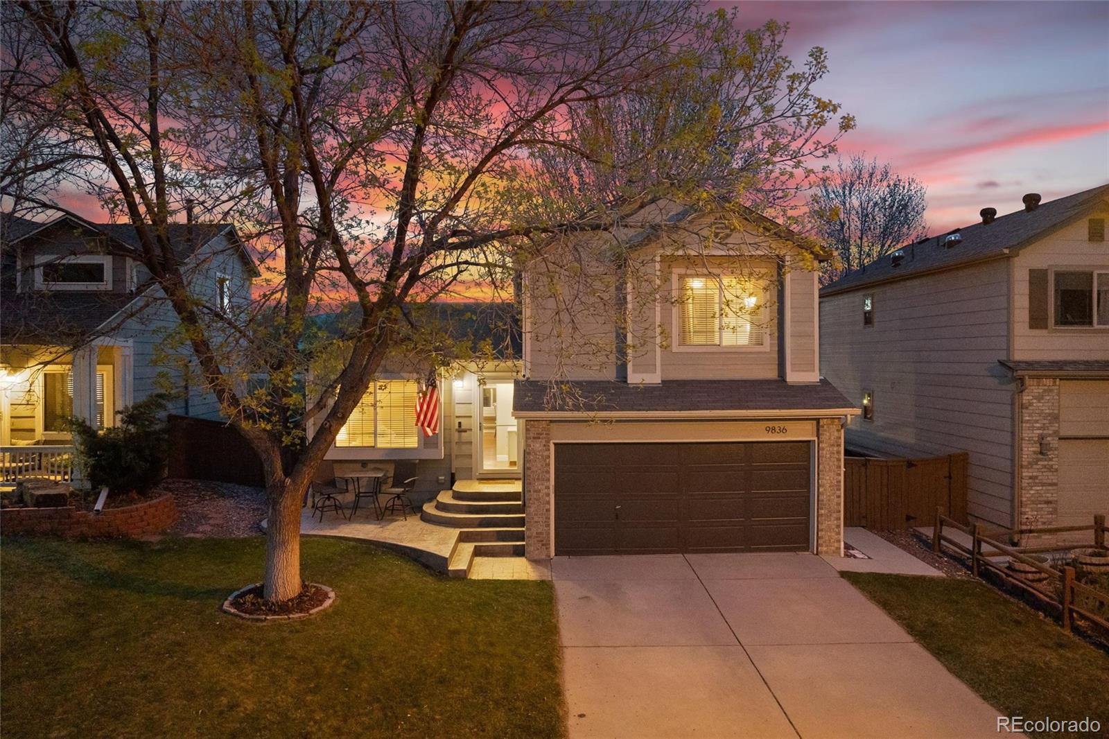 9836 South Castle Ridge Circle Highlands Ranch, CO 80129 - Photo 28 of 28 a front view of a house with garden