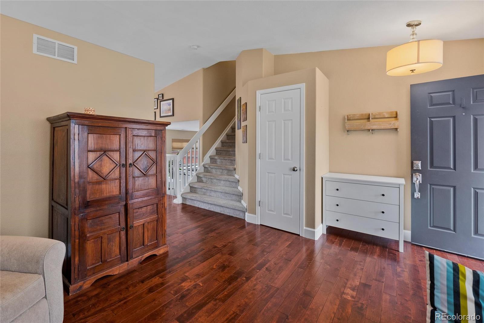 9836 South Castle Ridge Circle Highlands Ranch, CO 80129 - Photo 3 of 28 wooden floor with white walls and windows