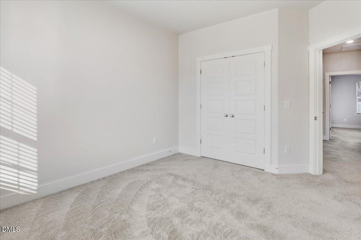 857 South Franklin Street Wake Forest, NC 27587 - Photo 19 of 30 an empty room with windows