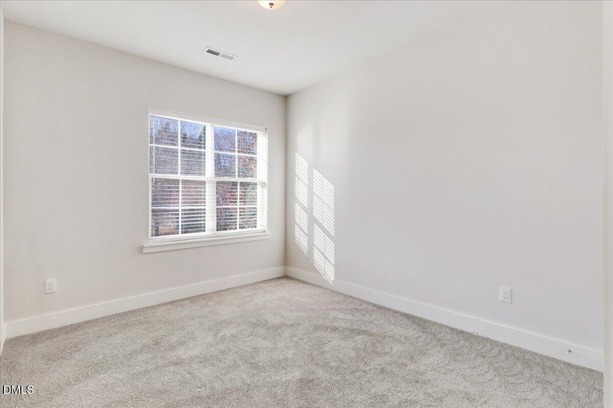 857 South Franklin Street Wake Forest, NC 27587 - Photo 20 of 30 a view of an empty room with a window