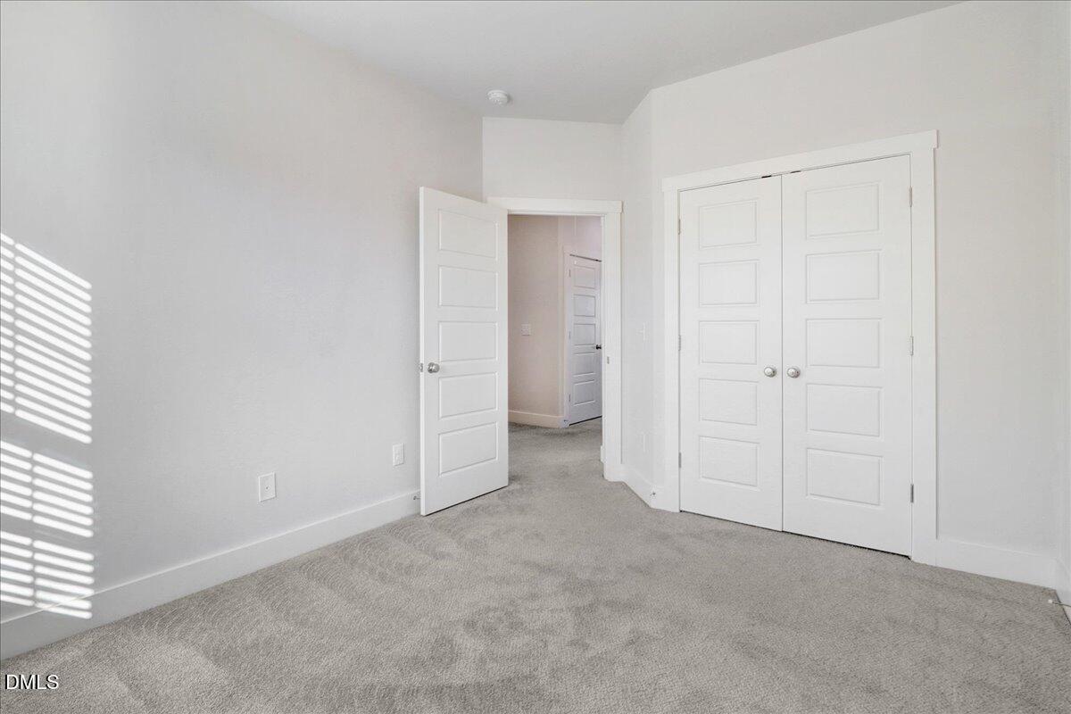 857 South Franklin Street Wake Forest, NC 27587 - Photo 21 of 30 an empty room with closet area