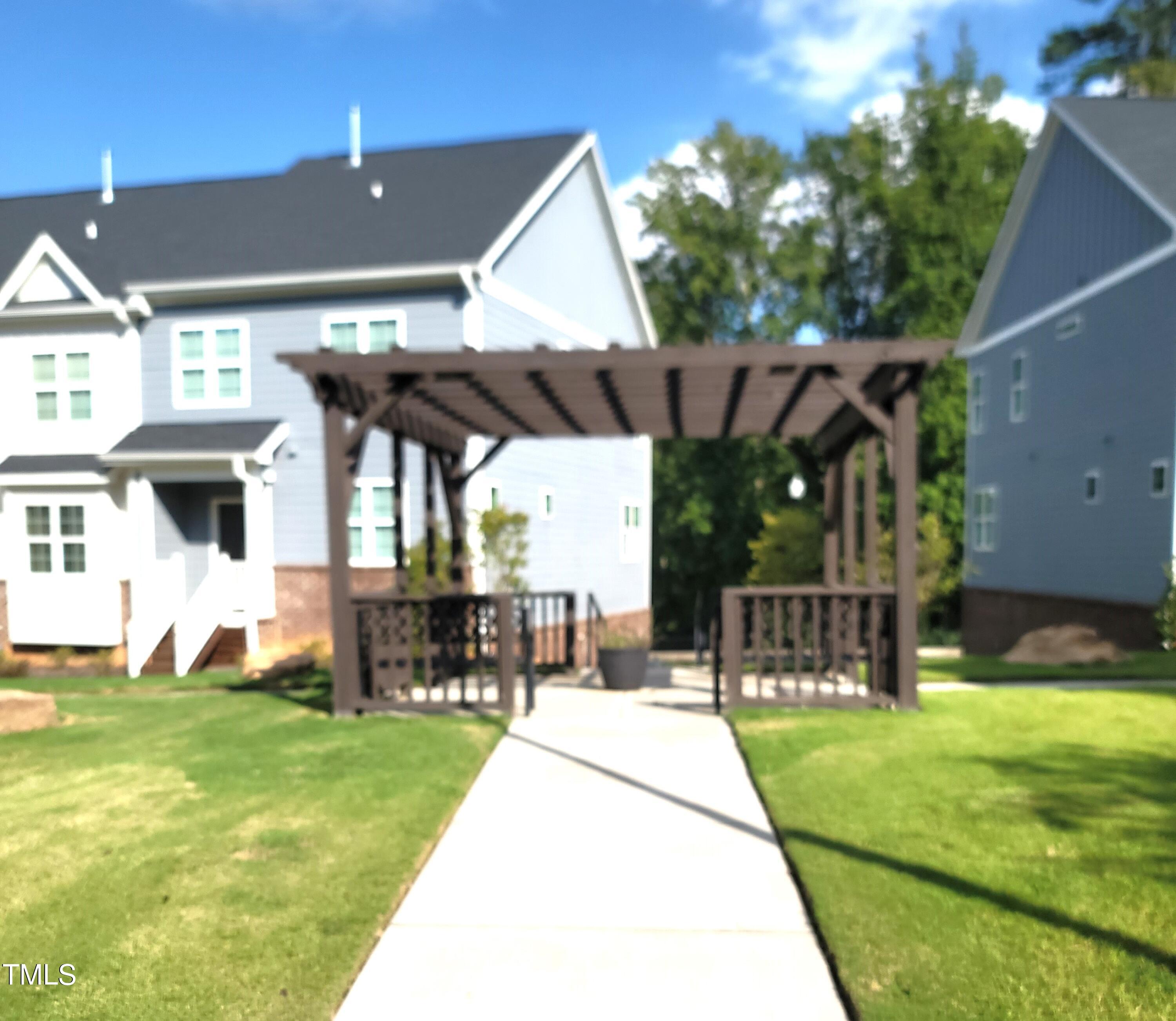 857 South Franklin Street Wake Forest, NC 27587 - Photo 27 of 30 a view of a patio with a table and chairs