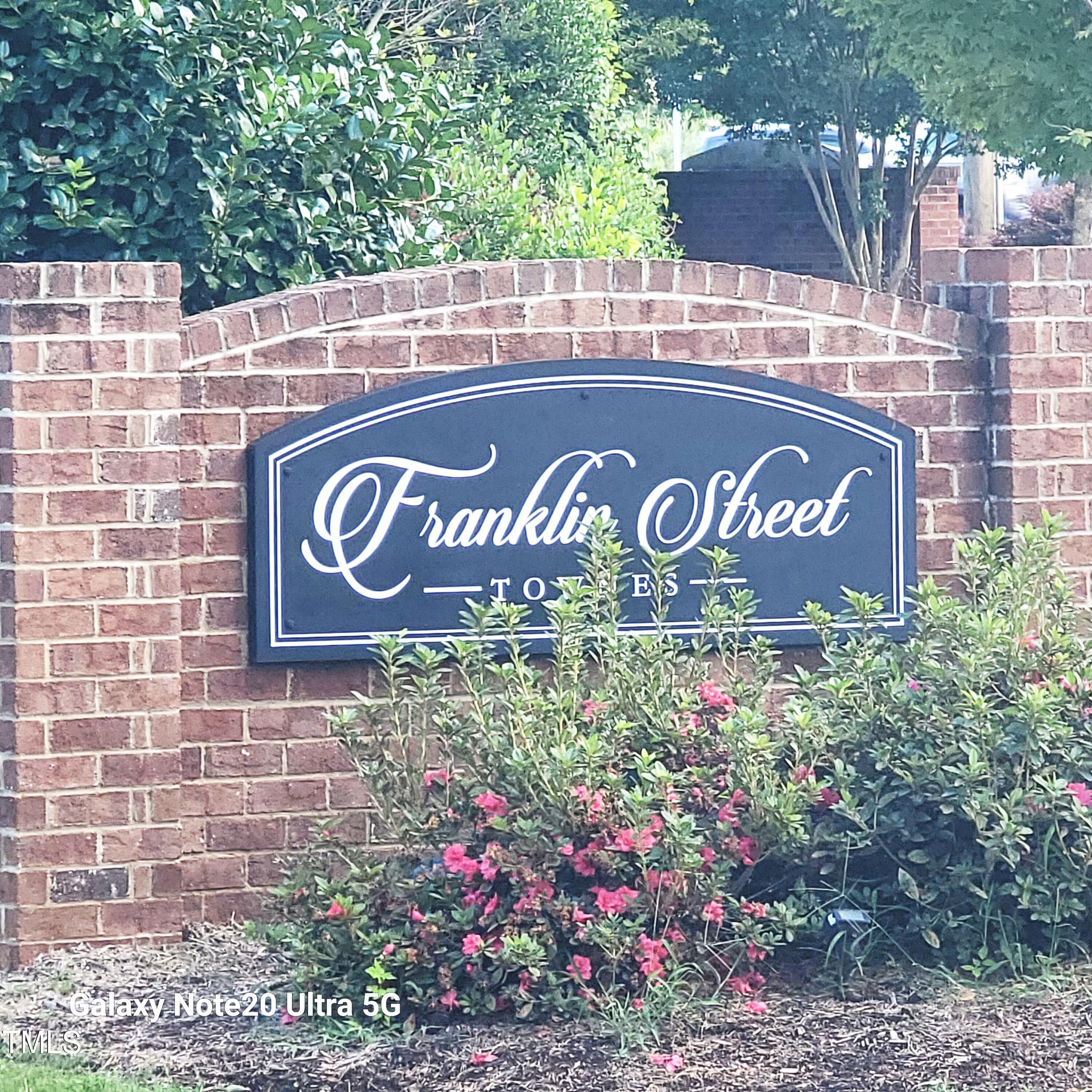 857 South Franklin Street Wake Forest, NC 27587 - Photo 30 of 30 a sign that is on a brick wall