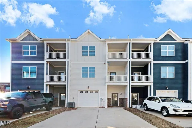 a view of a car parked in front of a building