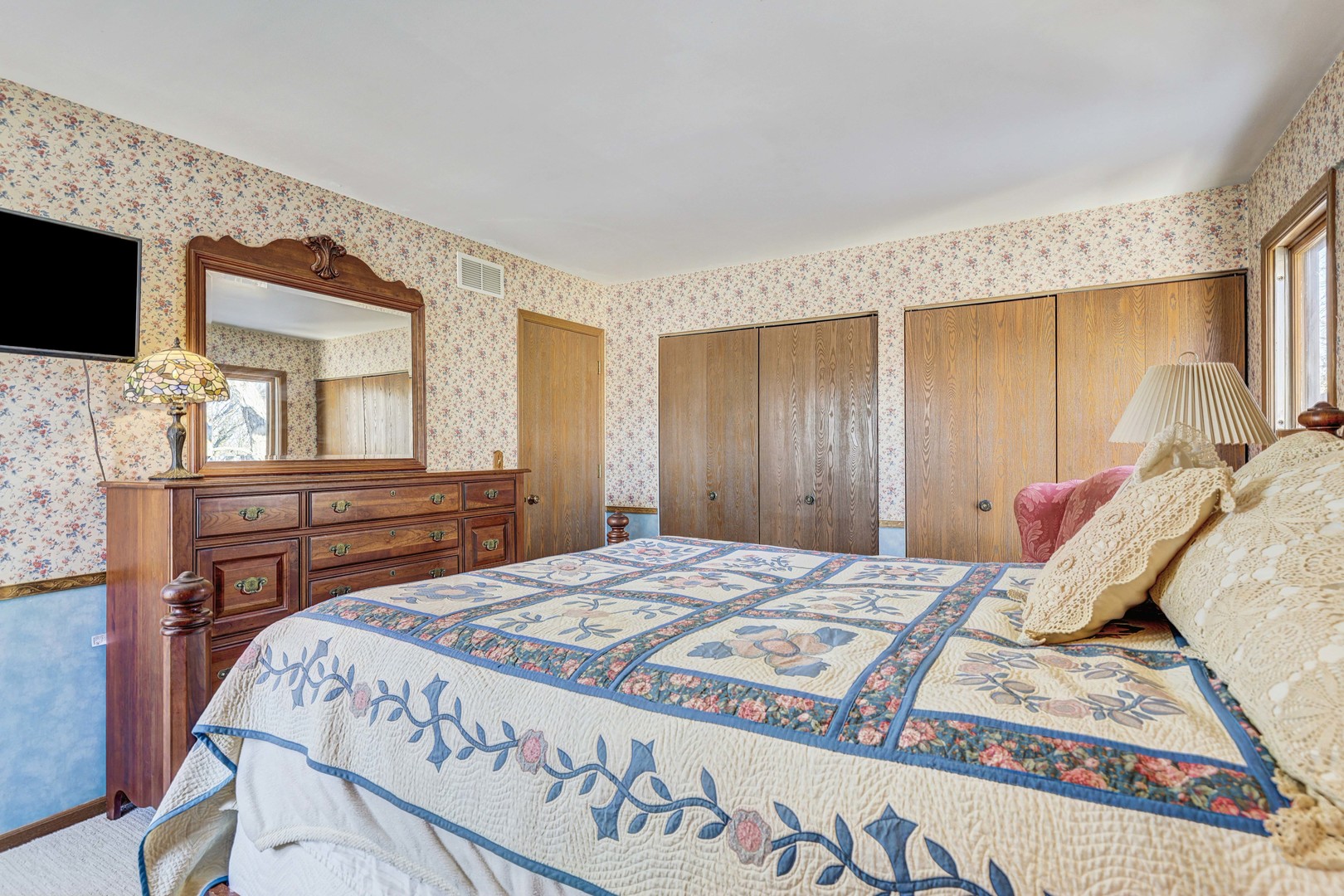 2308 Modaff Road Naperville, IL 60565 - Photo 25 of 46 a bed sitting in a bedroom next to a window with dresser