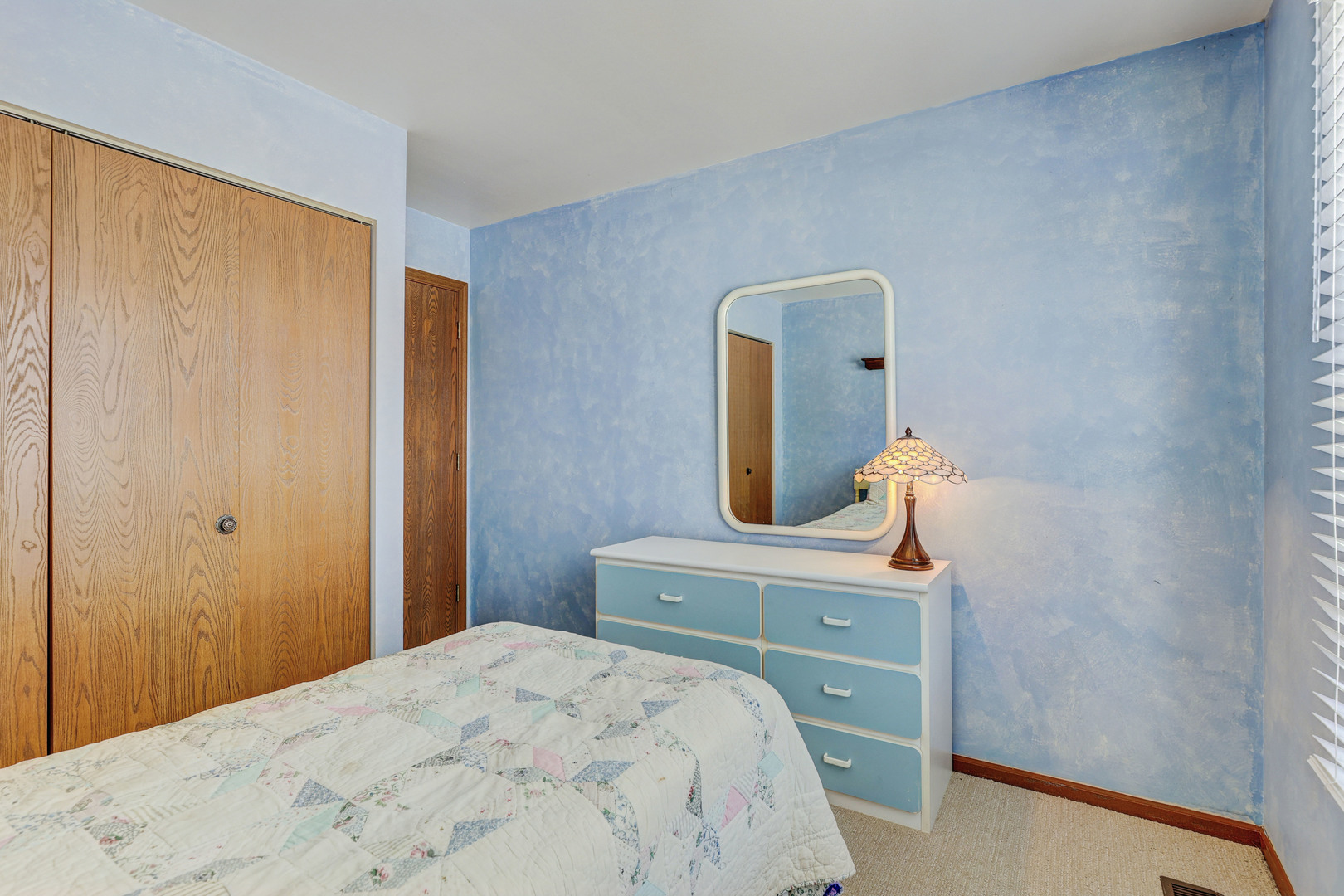 2308 Modaff Road Naperville, IL 60565 - Photo 28 of 46 a bedroom with a bed and a dresser