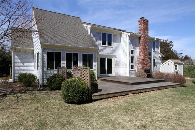92 Gibson Road Orleans, MA 02653 - Photo 24 of 26 a front view of a house with garden