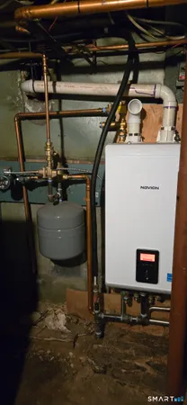 a kitchen with stainless steel appliances granite countertop a refrigerator a sink a stove a microwave and island