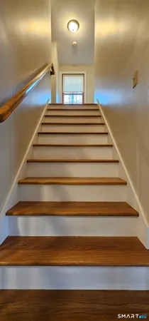 a bathroom with a tub a toilet and a sink