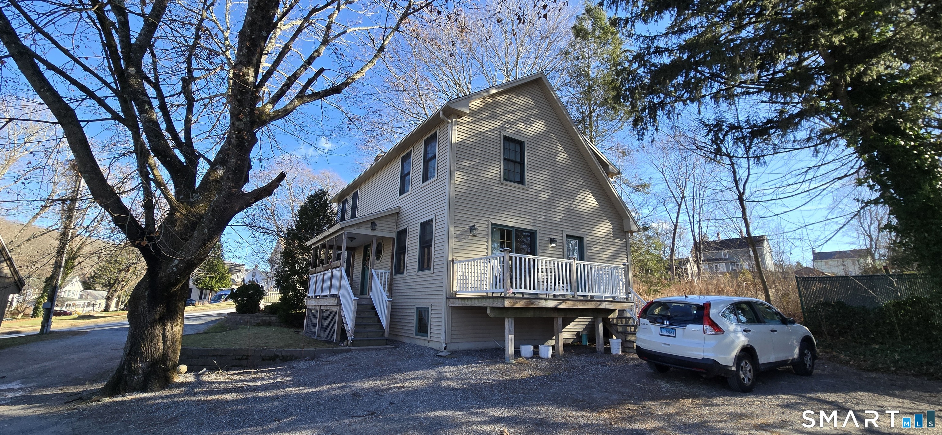 87 Main Street Deep River, CT 06417 - Photo 5 of 37 a front view of a house with a garden