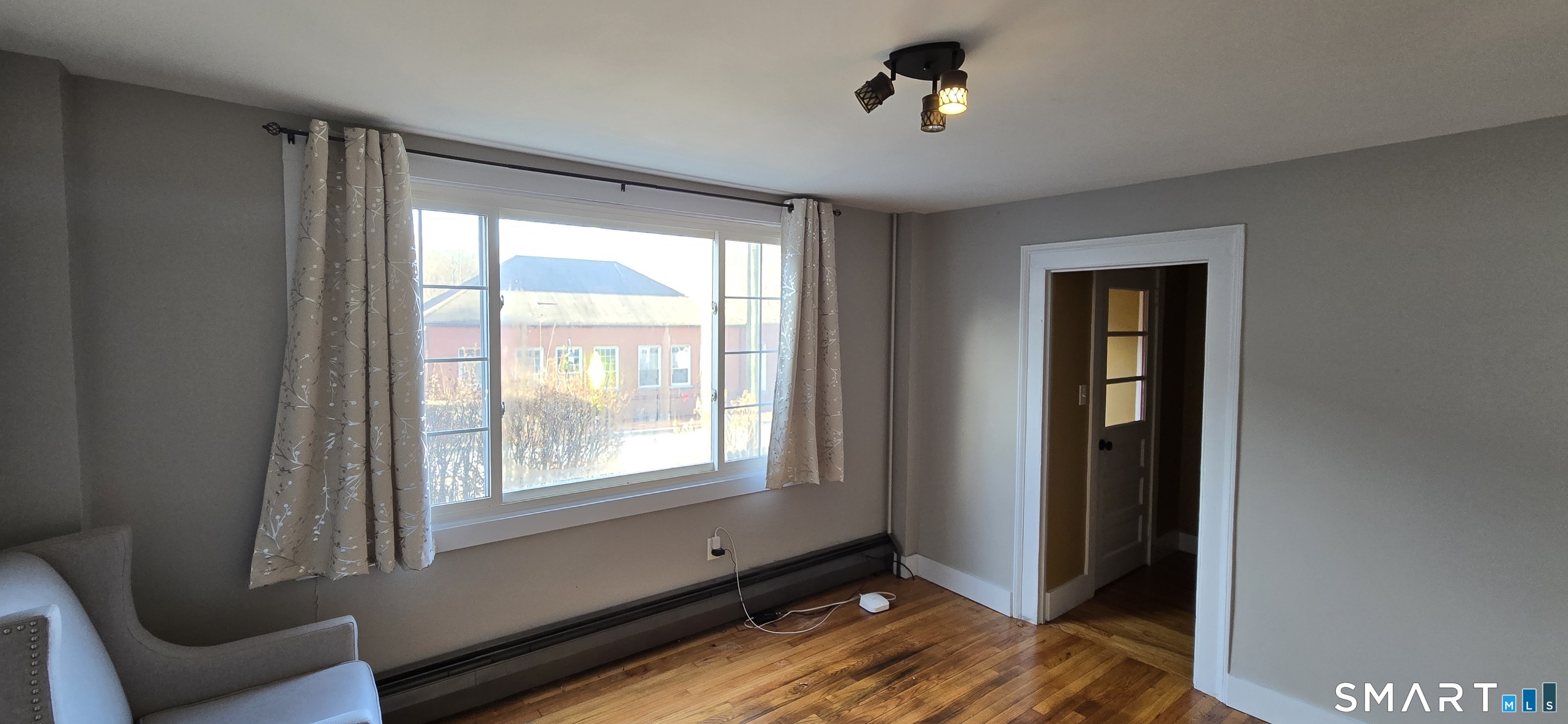 87 Main Street Deep River, CT 06417 - Photo 8 of 37 a view of an empty room with a window