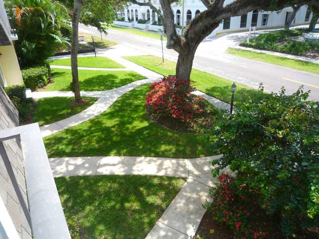 837 Camelia Lane, Unit 7 Vero Beach, FL 32963 - Photo 1 of 20 a view of a garden with a yard