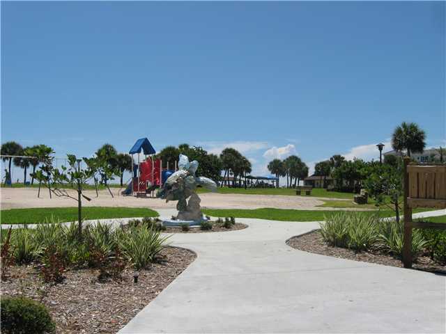837 Camelia Lane, Unit 7 Vero Beach, FL 32963 - Photo 12 of 20 a view of a garden and swimming pool