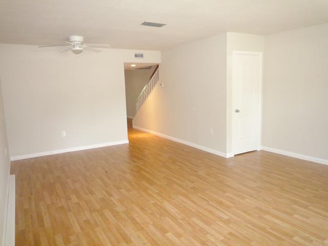 837 Camelia Lane, Unit 7 Vero Beach, FL 32963 - Photo 8 of 20 a view of a room with wooden floor