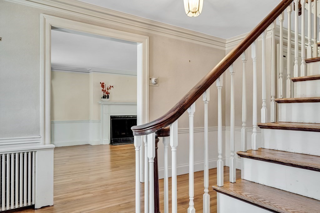 11 Edgewood Road Lexington, MA 02420 - Photo 3 of 22 a view of entryway with wooden floor and stairs