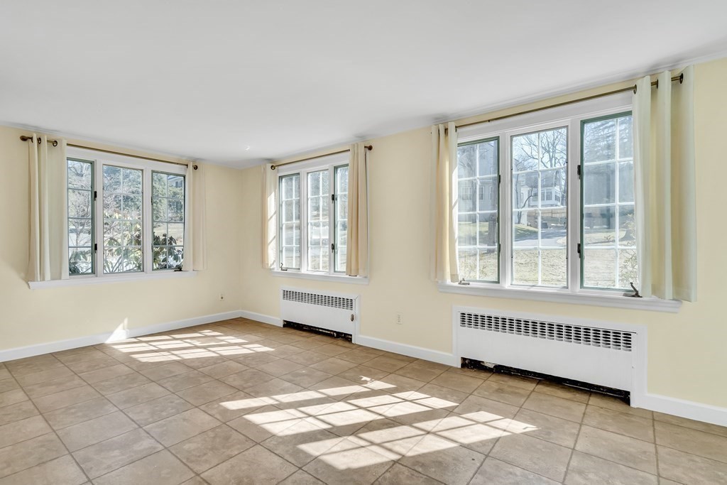 11 Edgewood Road Lexington, MA 02420 - Photo 6 of 22 a view of an empty room with a window