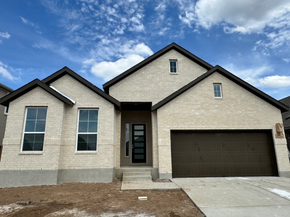 508 Raleigh Drive Georgetown, TX 78633 - Photo 1 of 1 View of front of house with concrete driveway and brick siding