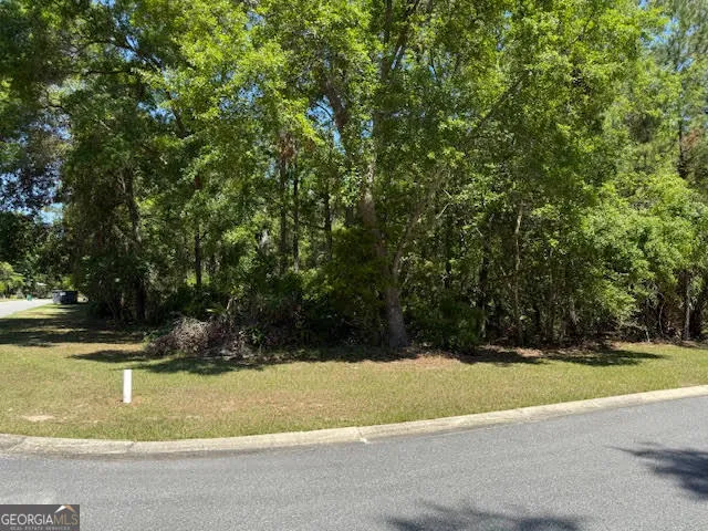 a view of swimming pool with a yard