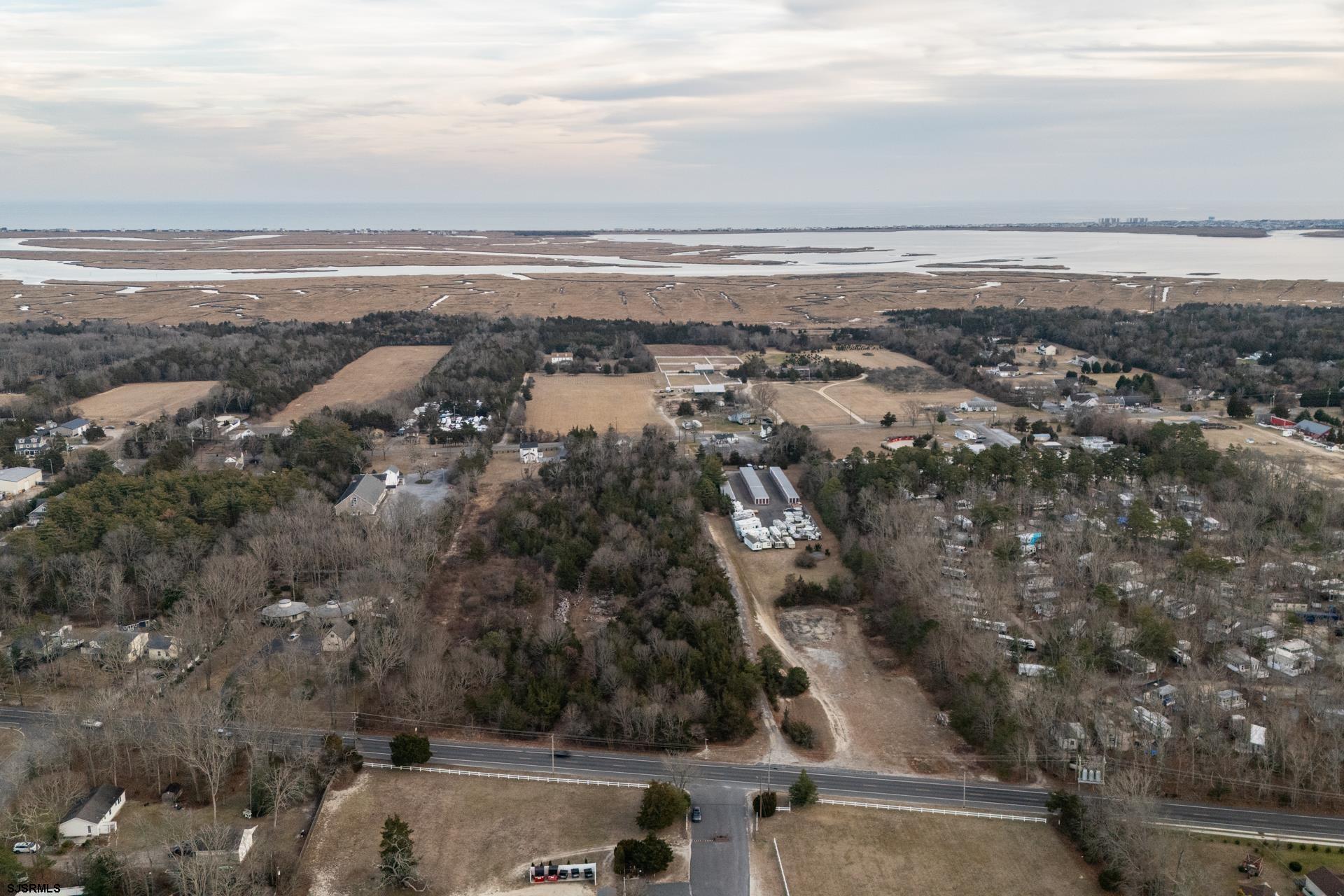 57 Corsons Tavern Road Ocean View, NJ 08230 - Photo 4 of 7 an aerial view of residential building and ocean