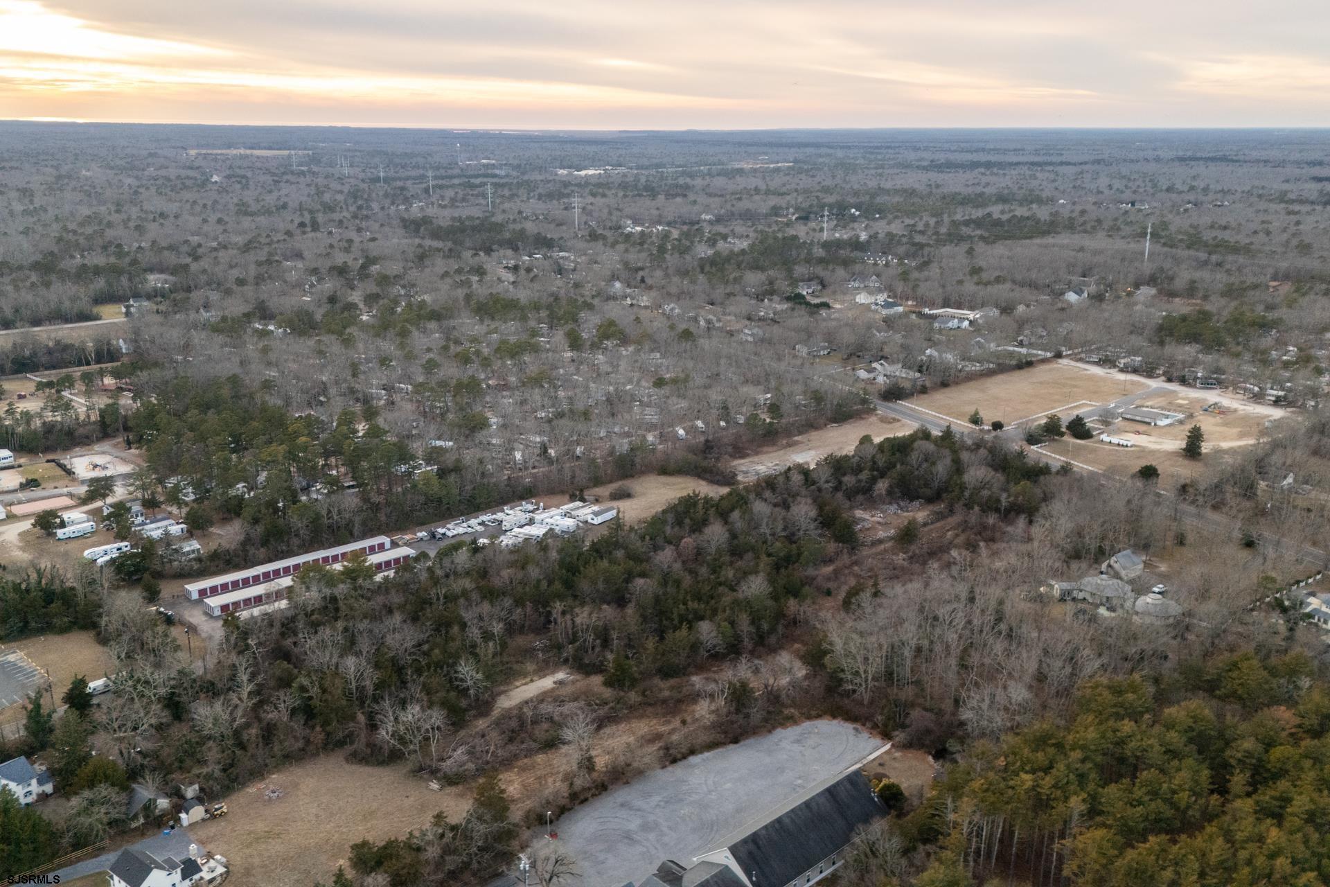 57 Corsons Tavern Road Ocean View, NJ 08230 - Photo 6 of 7 an aerial view of house with yard and mountain view in back
